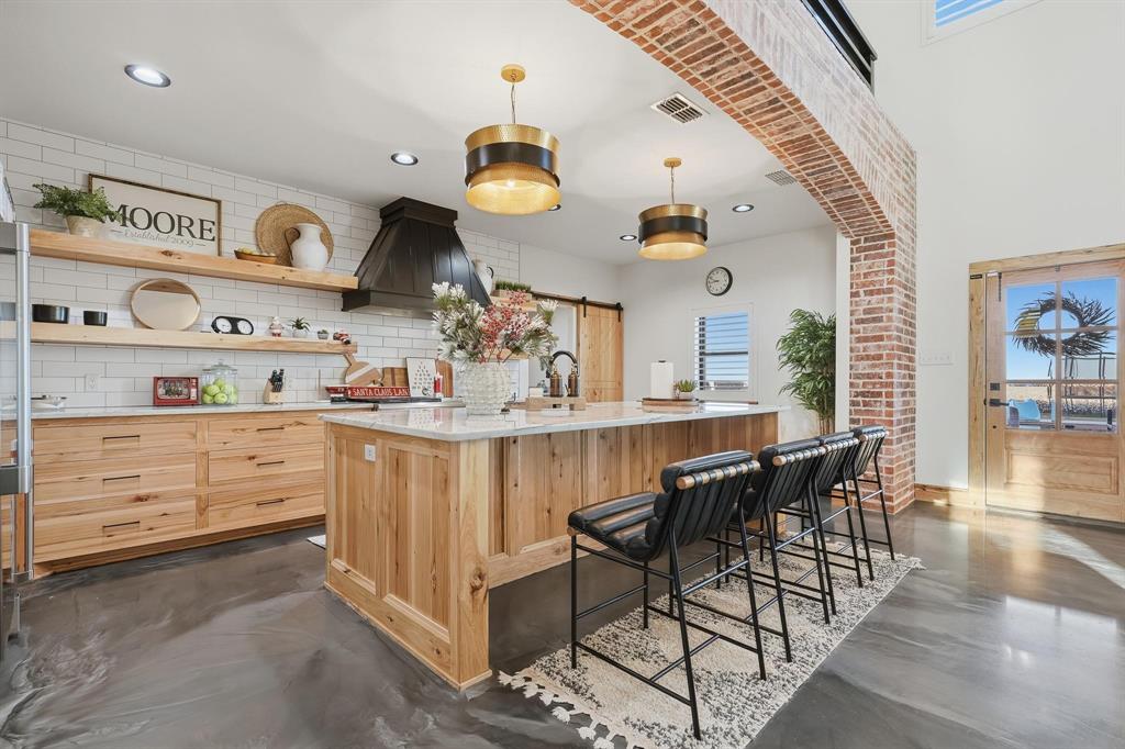 519 Wimberly Road Merkel, TX 79536 - Photo 13 of 40 a kitchen with cabinets and outdoor seating