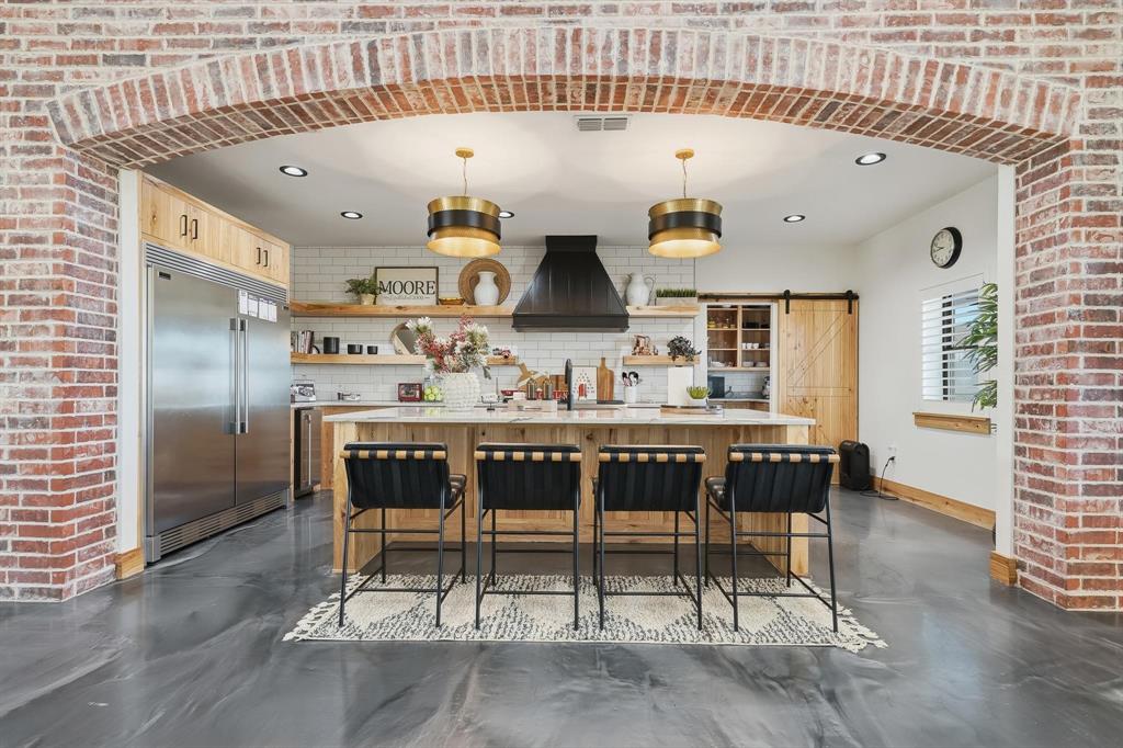 519 Wimberly Road Merkel, TX 79536 - Photo 14 of 40 a kitchen with a table and chairs in it