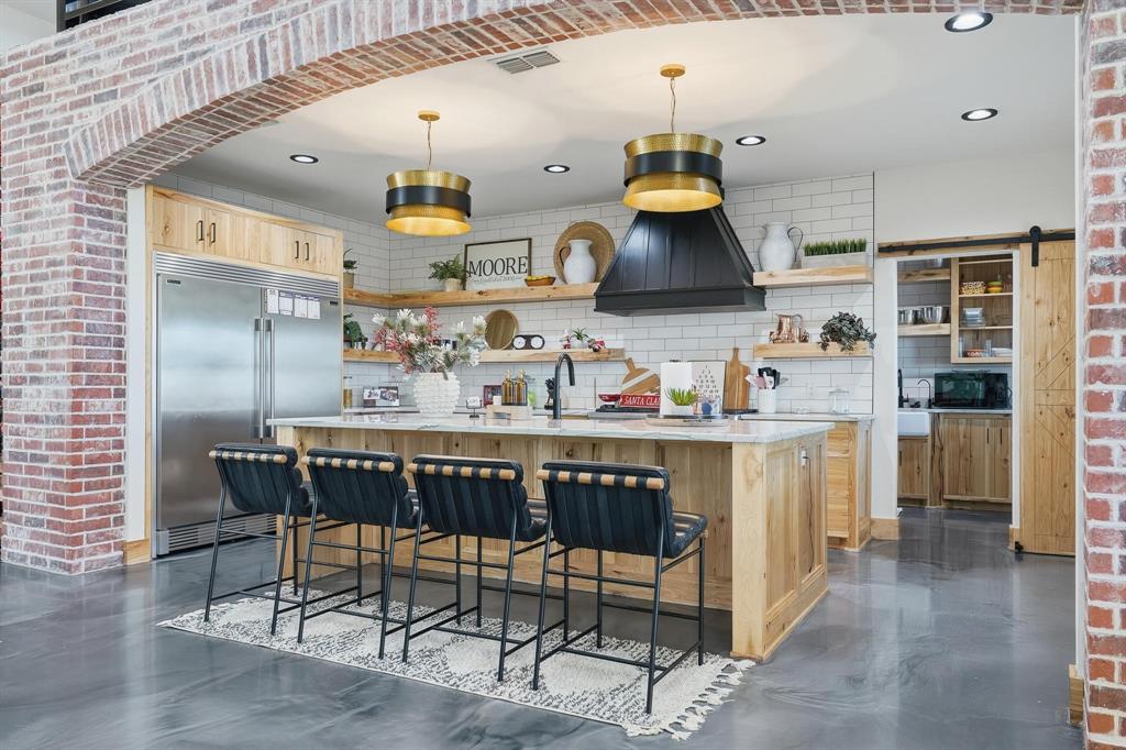 519 Wimberly Road Merkel, TX 79536 - Photo 15 of 40 a kitchen with cabinets and chairs