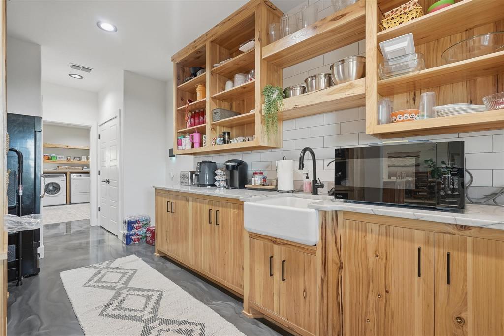 519 Wimberly Road Merkel, TX 79536 - Photo 19 of 40 a kitchen with stainless steel appliances granite countertop a sink and cabinets