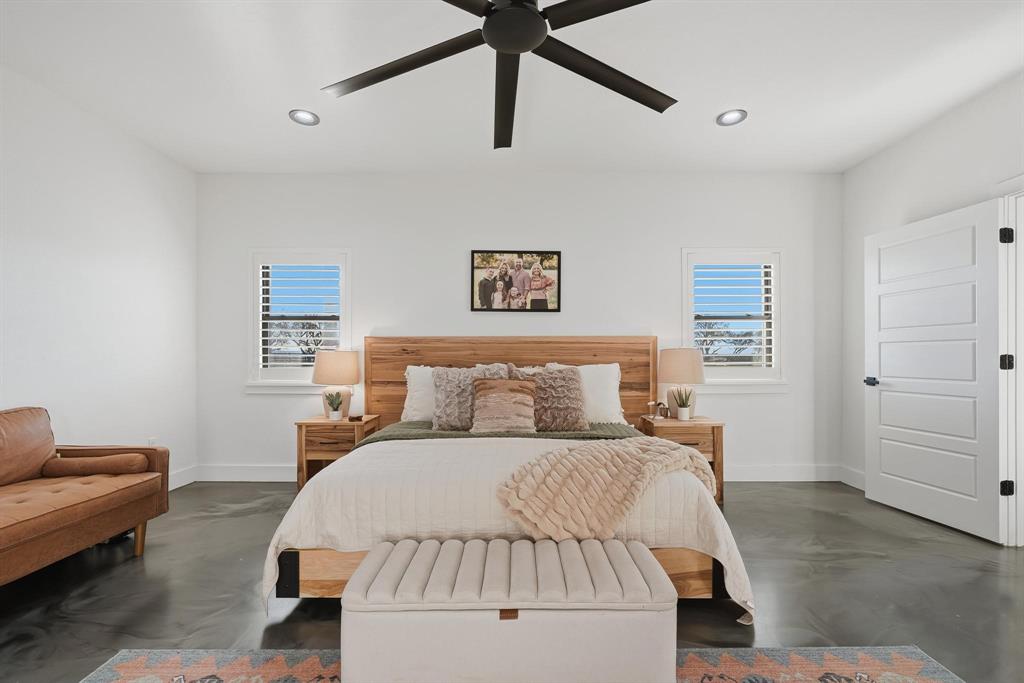 519 Wimberly Road Merkel, TX 79536 - Photo 24 of 40 a bedroom with a bed couch and window