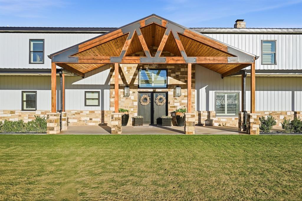 519 Wimberly Road Merkel, TX 79536 - Photo 3 of 40 a front view of a house with swimming pool outdoor seating and windows