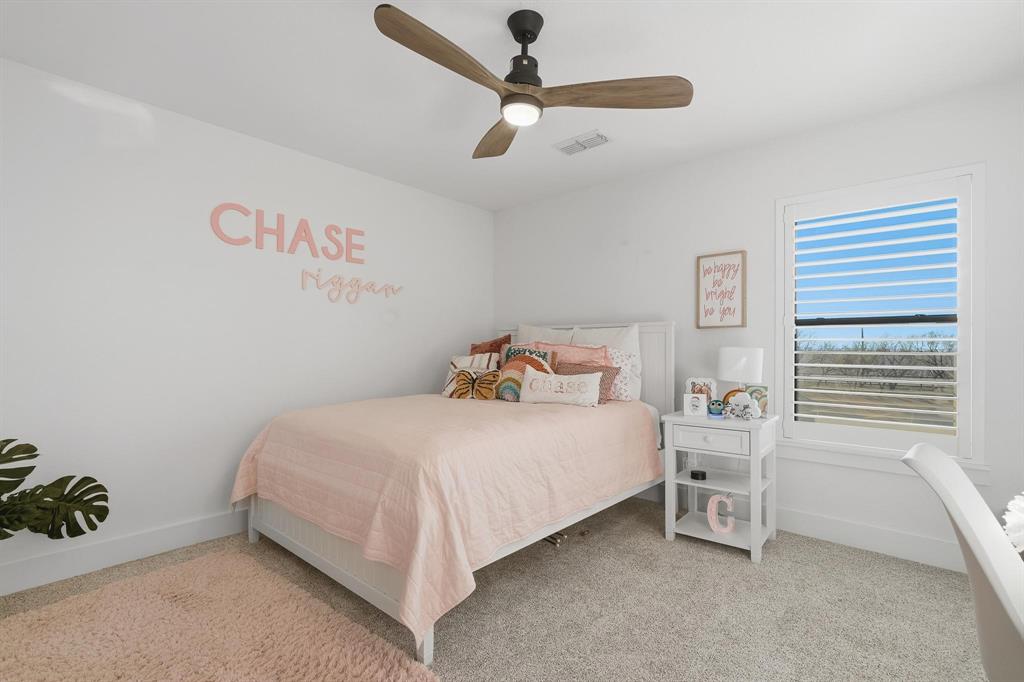 519 Wimberly Road Merkel, TX 79536 - Photo 33 of 40 a bedroom with a bed and a ceiling fan