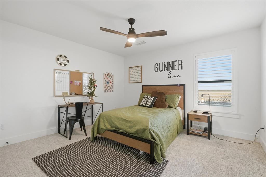 519 Wimberly Road Merkel, TX 79536 - Photo 36 of 40 a bedroom with a bed and a table