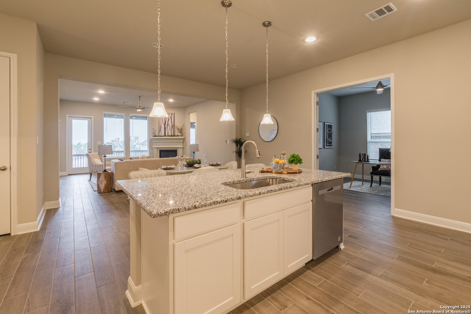 108 Rosanna Ridge Universal City, TX 78148 - Photo 11 of 58 a bathroom with a granite countertop sink a toilet and a mirror