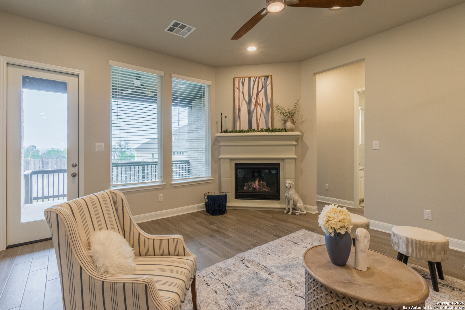 108 Rosanna Ridge Universal City, TX 78148 - Photo 15 of 58 a living room with furniture and a fireplace