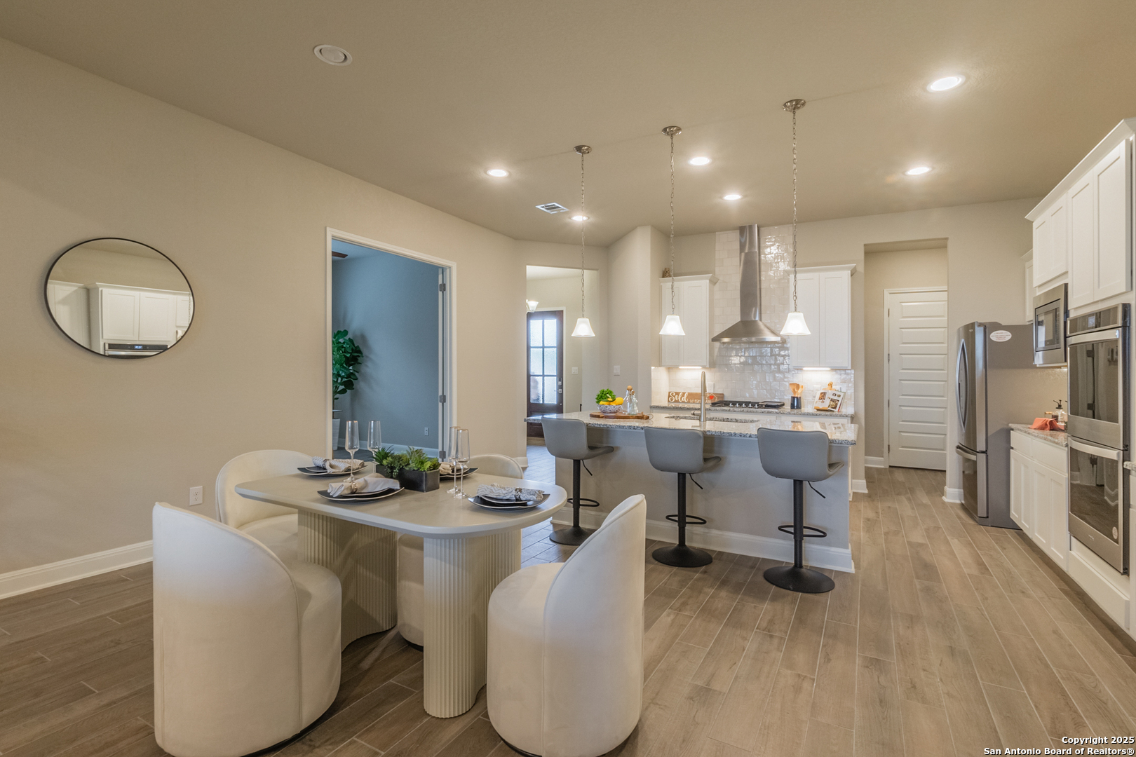 108 Rosanna Ridge Universal City, TX 78148 - Photo 18 of 58 a dining room with furniture a large window and a chandelier