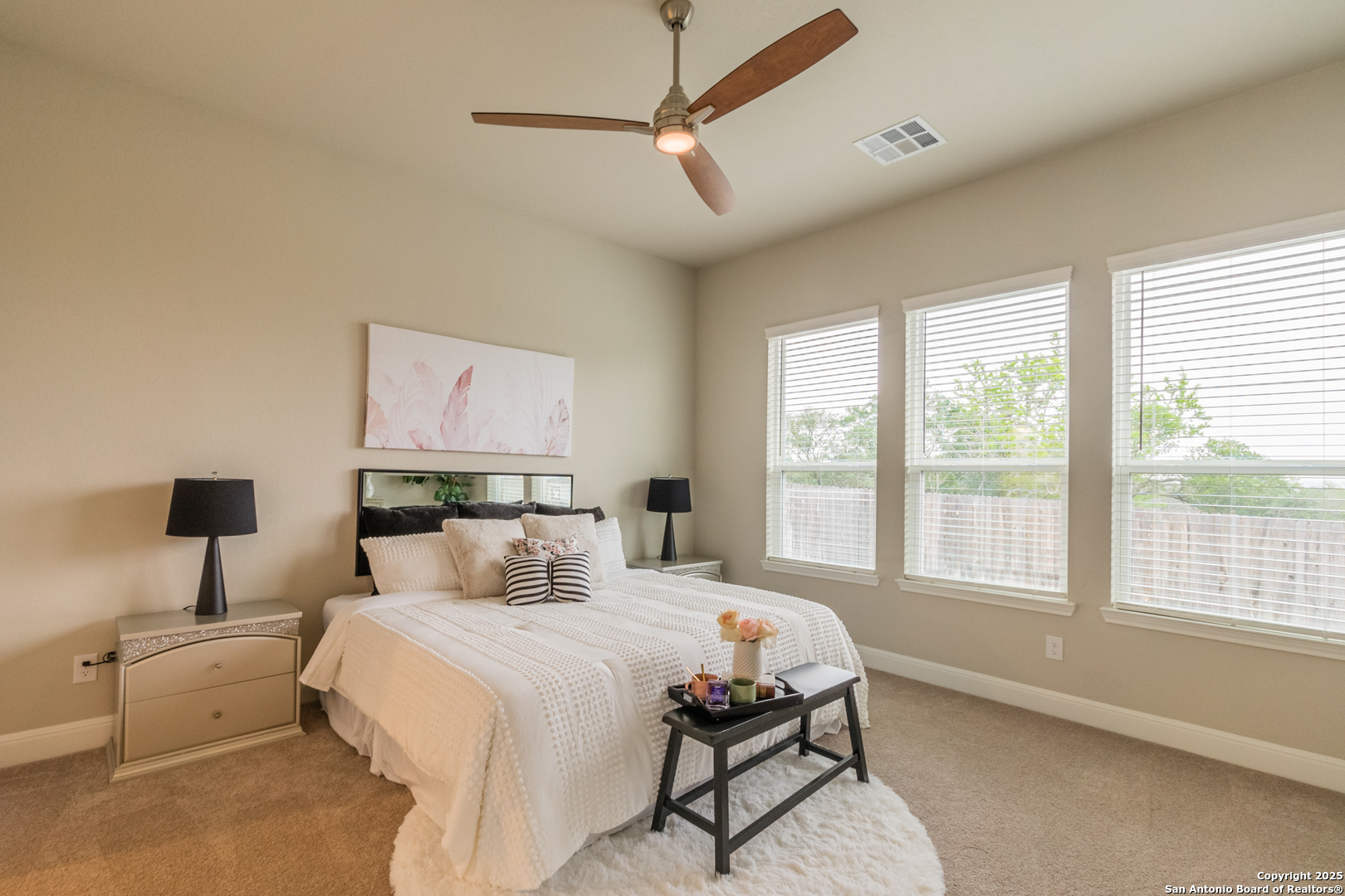 108 Rosanna Ridge Universal City, TX 78148 - Photo 21 of 58 a bedroom with a large bed and a window