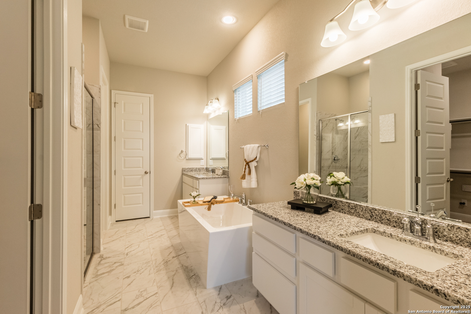 108 Rosanna Ridge Universal City, TX 78148 - Photo 26 of 58 a bathroom with a sink double vanity and a mirror