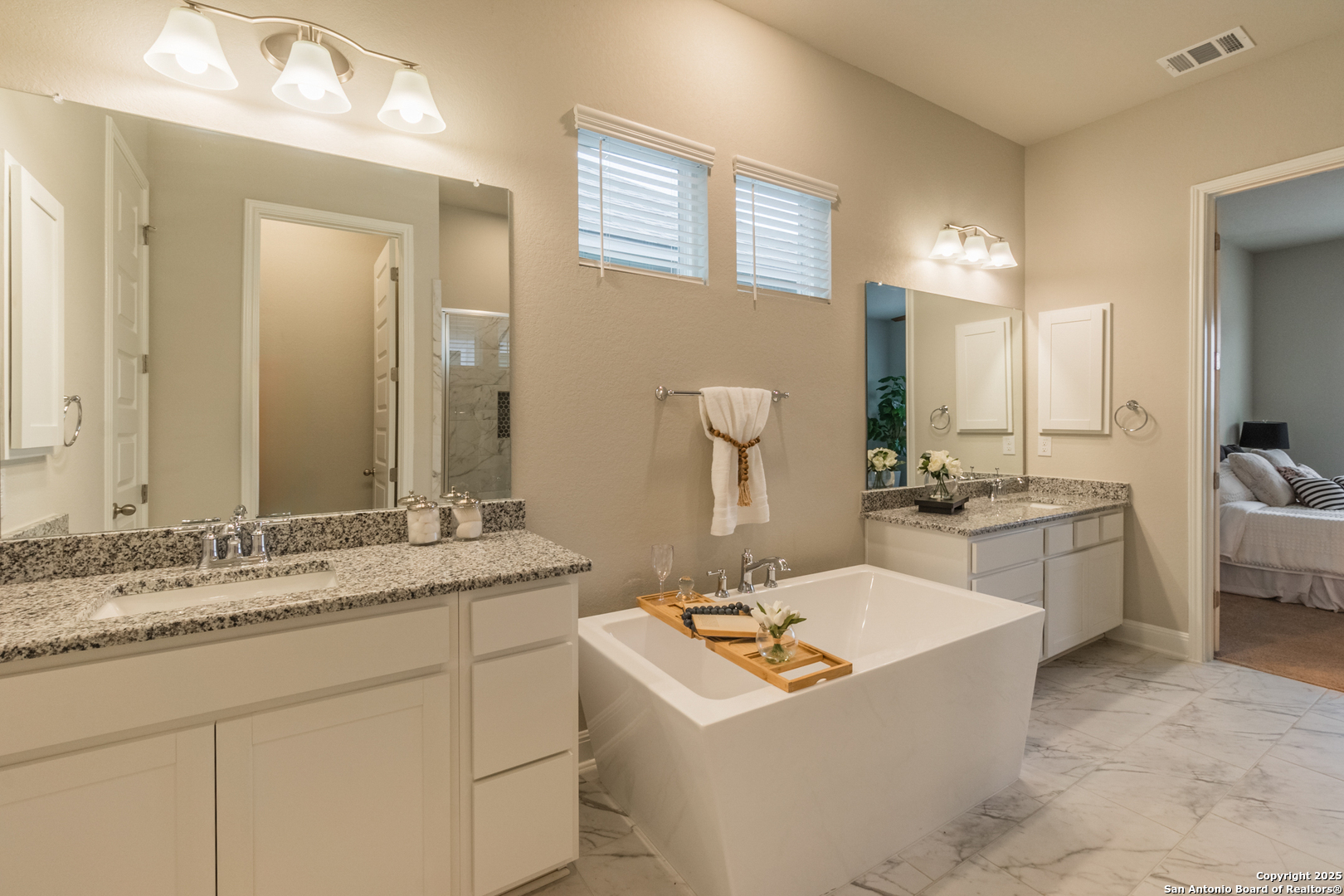 108 Rosanna Ridge Universal City, TX 78148 - Photo 29 of 58 a bathroom with a sink double vanity granite and a mirror