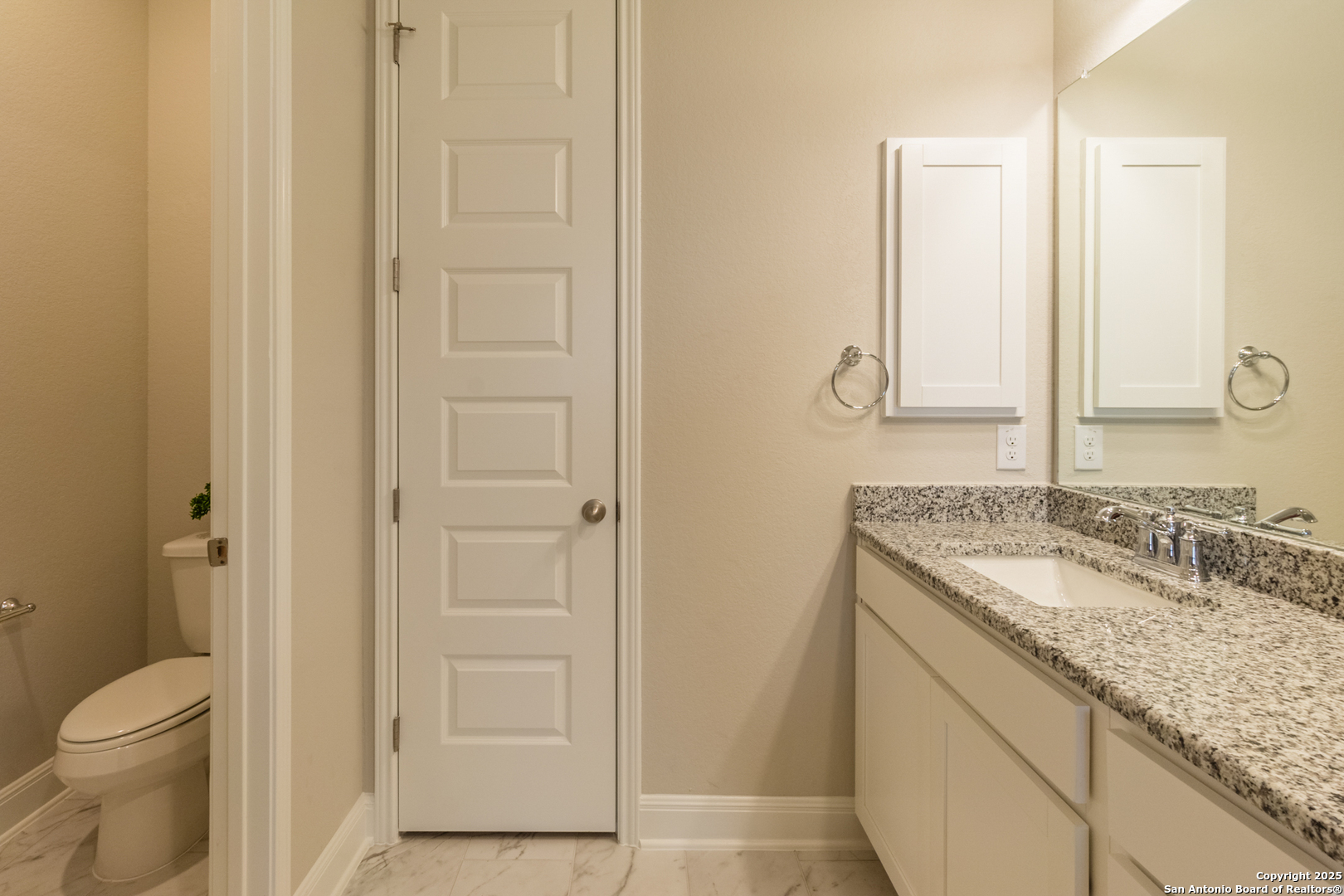 108 Rosanna Ridge Universal City, TX 78148 - Photo 31 of 58 a bathroom with a granite countertop sink and a mirror
