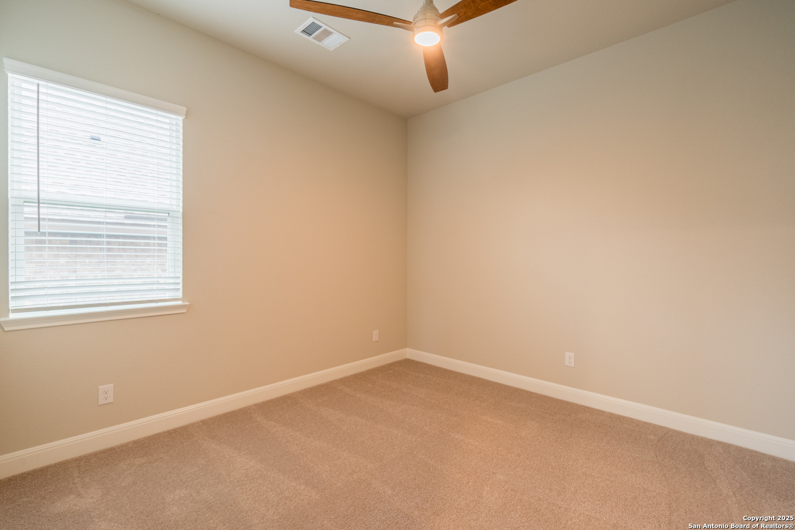 108 Rosanna Ridge Universal City, TX 78148 - Photo 37 of 58 an empty room with a window and a fan