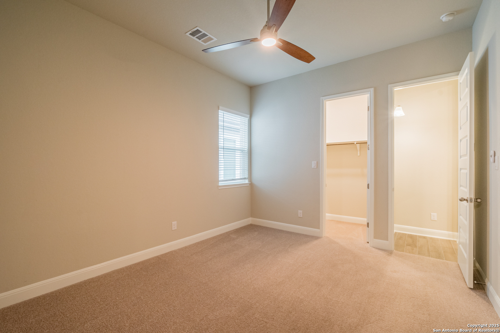 108 Rosanna Ridge Universal City, TX 78148 - Photo 40 of 58 an empty room with closet and windows