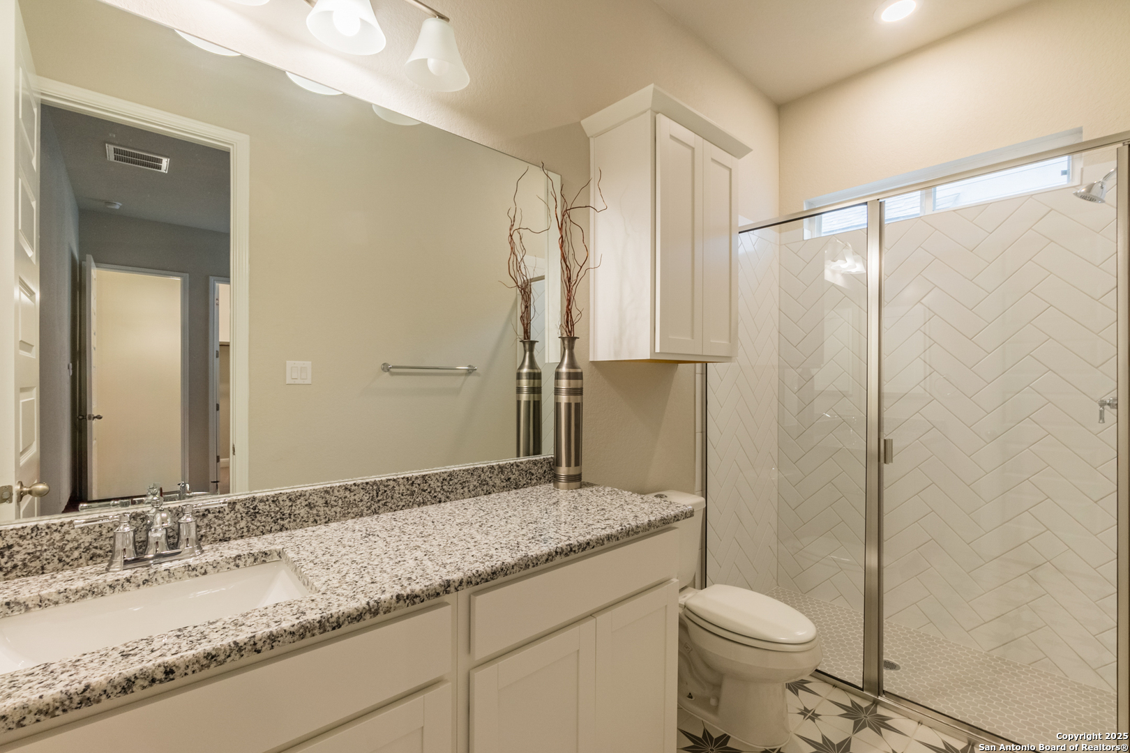 108 Rosanna Ridge Universal City, TX 78148 - Photo 41 of 58 a bathroom with a granite countertop sink toilet and shower