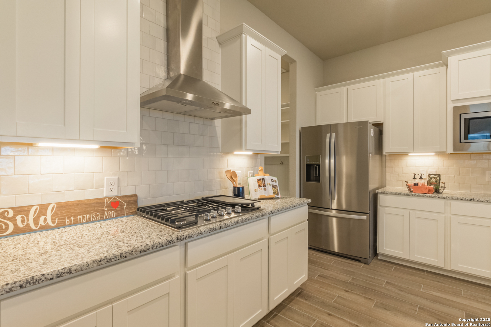 108 Rosanna Ridge Universal City, TX 78148 - Photo 8 of 58 a kitchen with refrigerator a stove a sink and cabinets