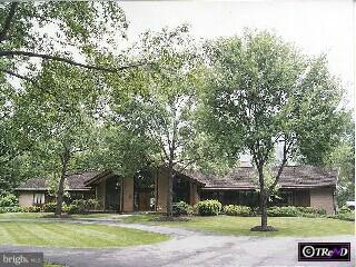429 Leopard Road Berwyn, PA 19312 - Photo 1 of 5 front view of a building with a tree