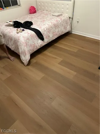 a bedroom with a bed and a cabinets