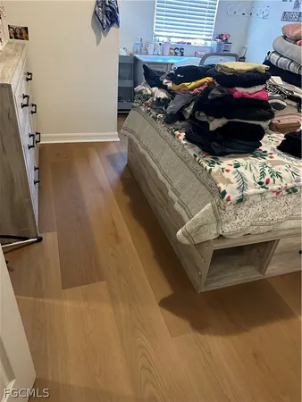 a bedroom with a bed and a dresser