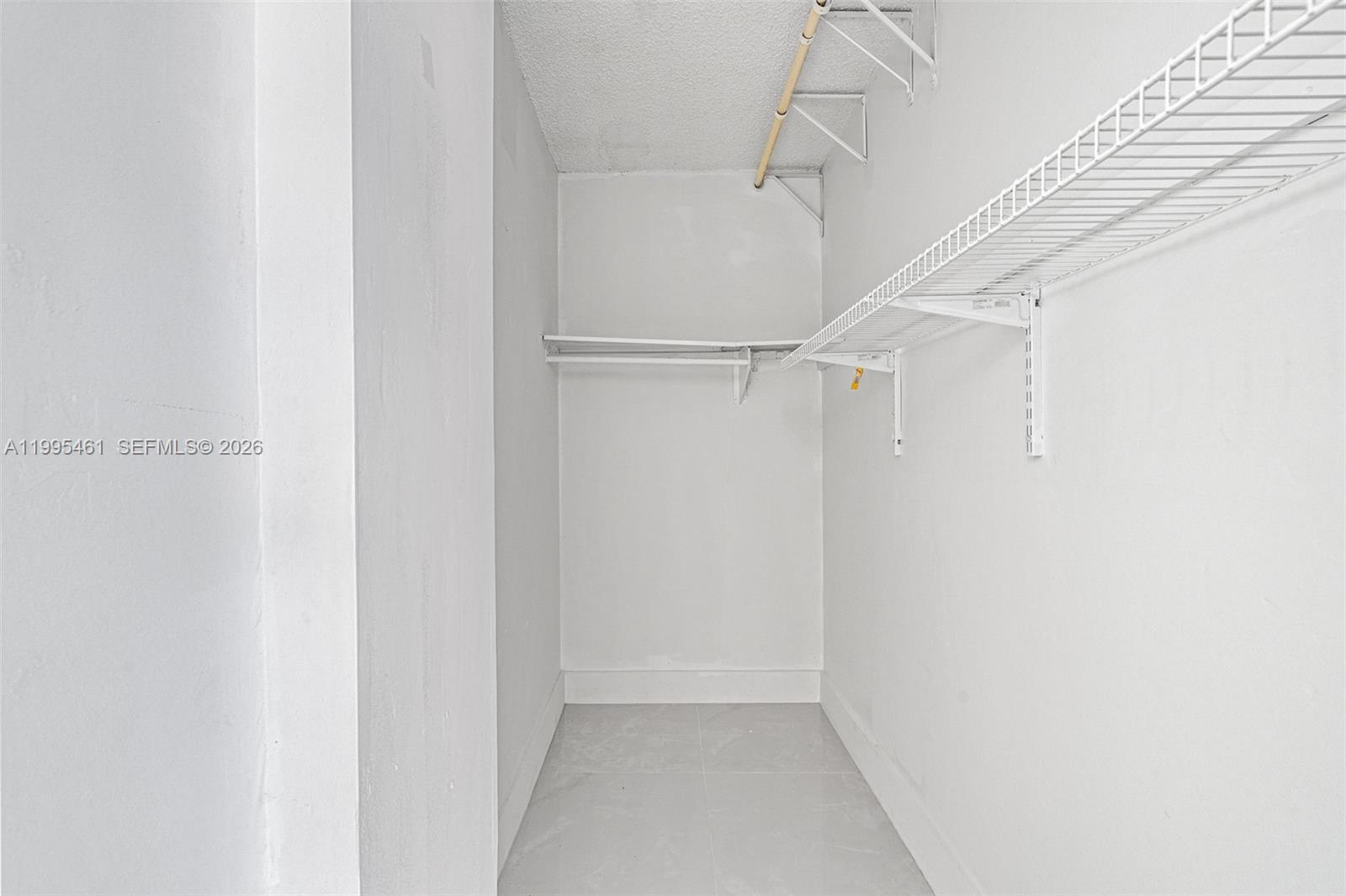 4801 Northwest 7th Street, Unit 40716 Miami, FL 33126 - Photo 12 of 26 a view of walk in closet