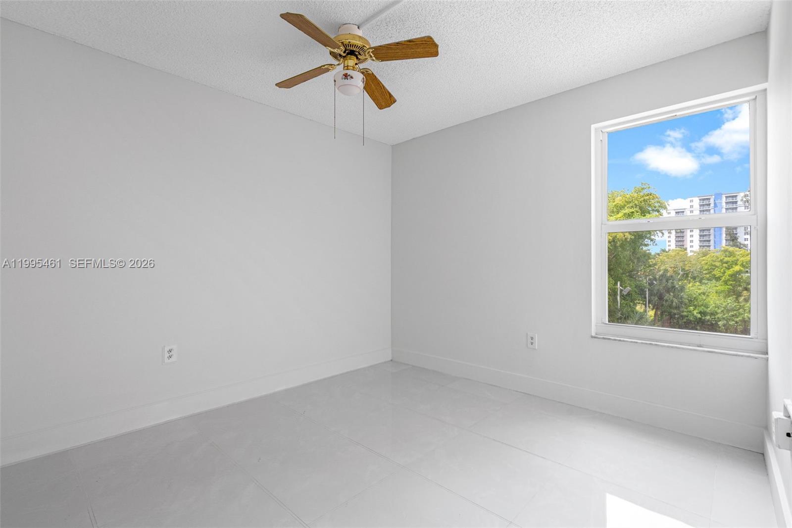 4801 Northwest 7th Street, Unit 40716 Miami, FL 33126 - Photo 14 of 26 an empty room with a window