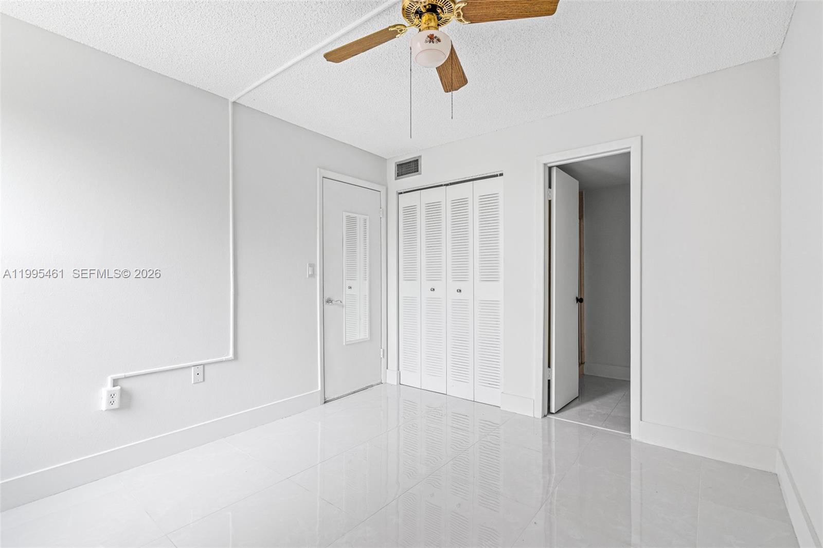 4801 Northwest 7th Street, Unit 40716 Miami, FL 33126 - Photo 15 of 26 a view of a chandelier fan and entryway
