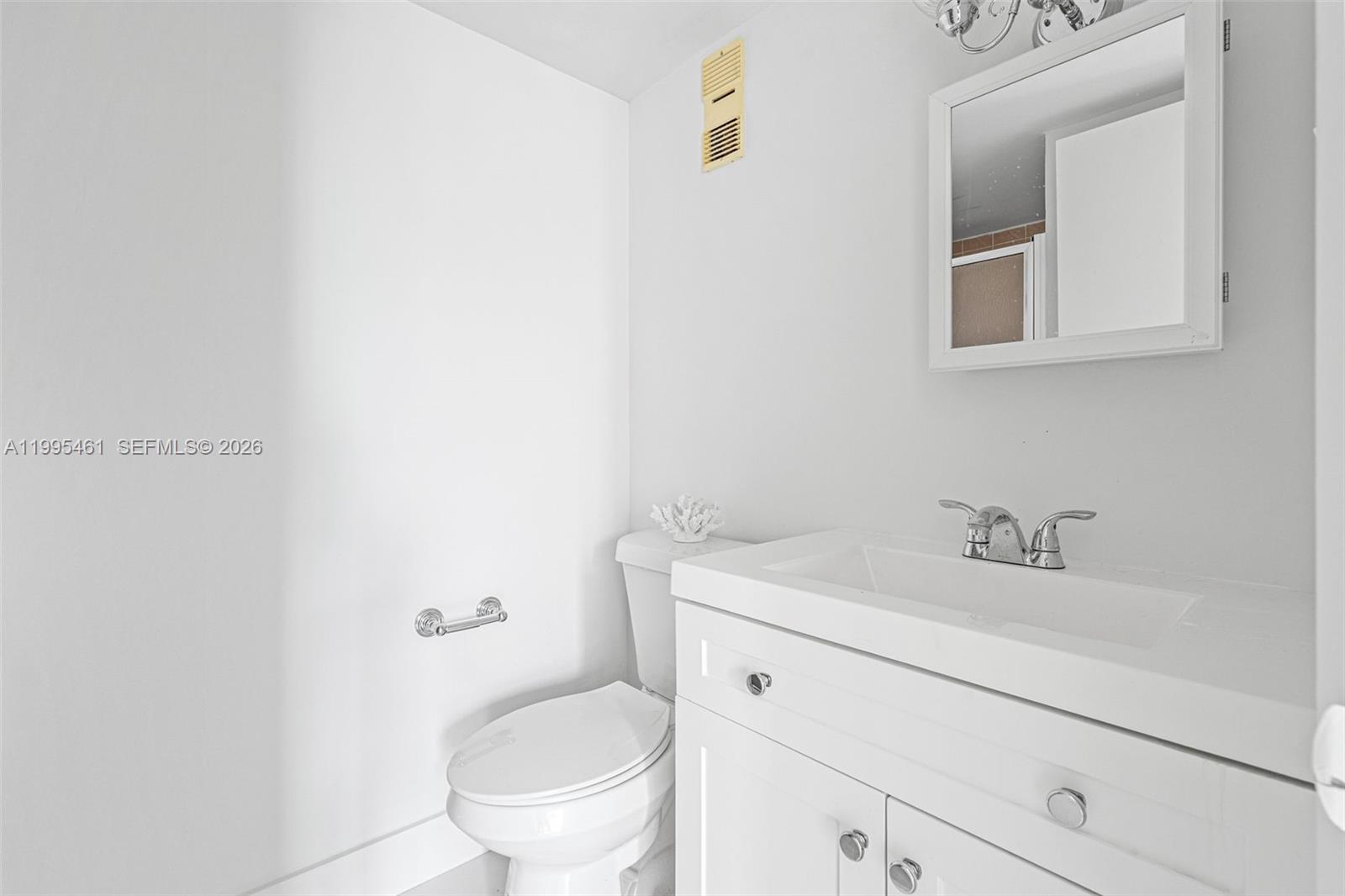 4801 Northwest 7th Street, Unit 40716 Miami, FL 33126 - Photo 16 of 26 a bathroom with a sink and a toilet
