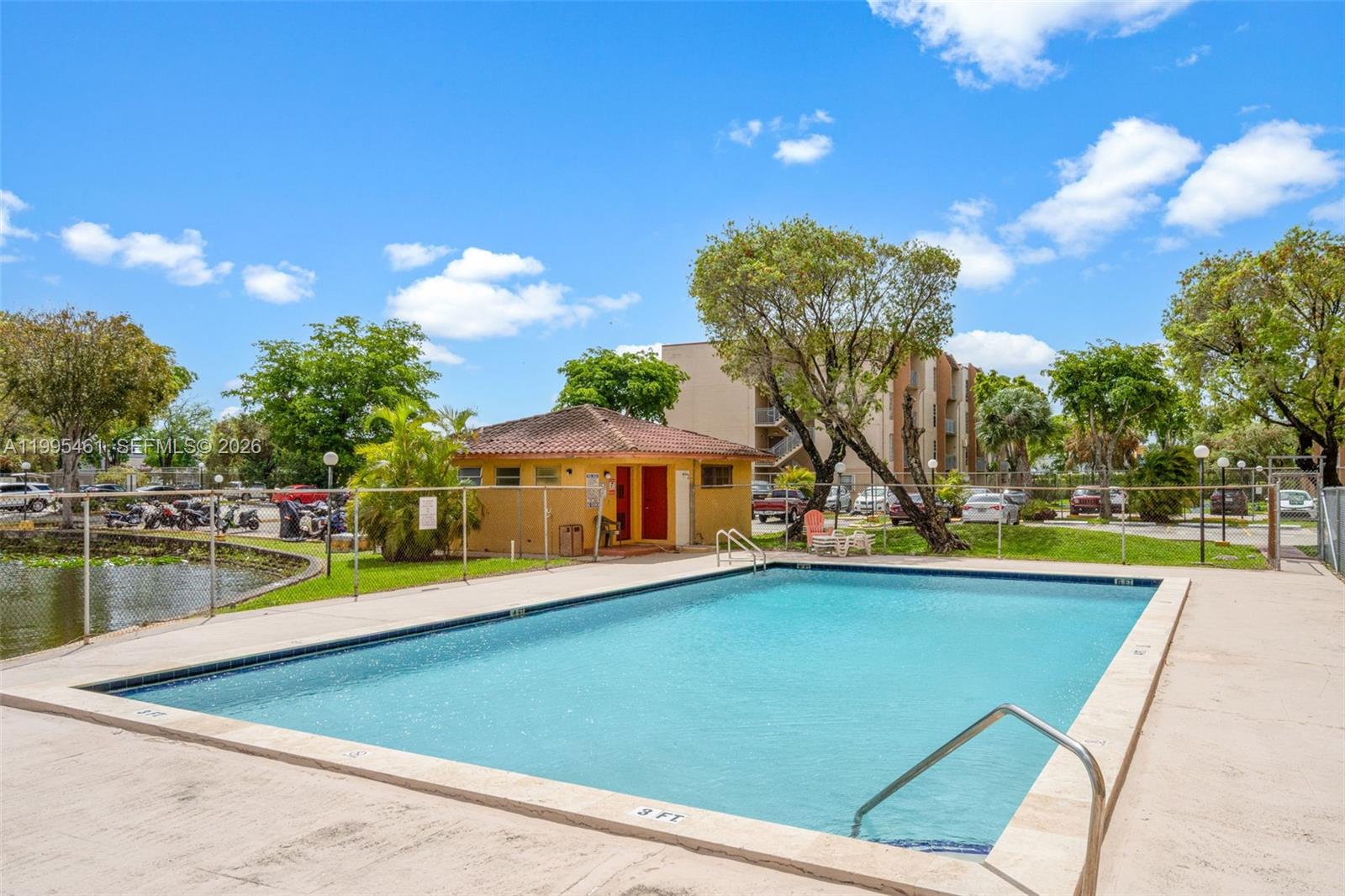 4801 Northwest 7th Street, Unit 40716 Miami, FL 33126 - Photo 22 of 26 a view of a house with pool and a yard