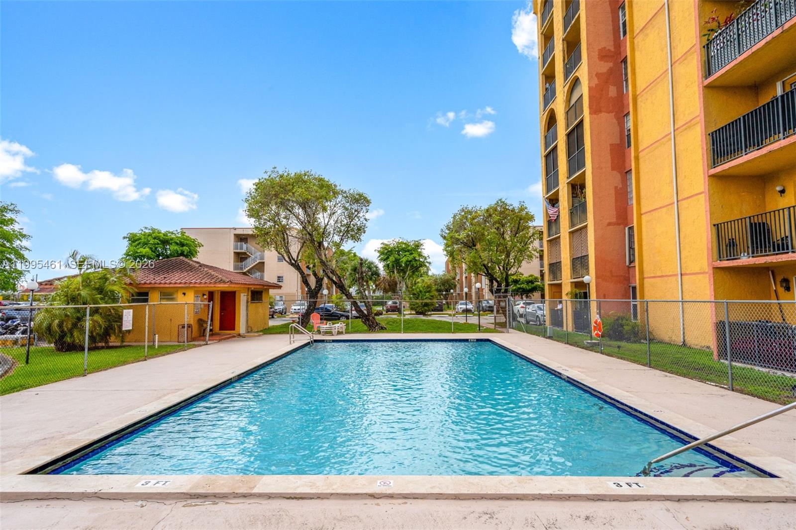 4801 Northwest 7th Street, Unit 40716 Miami, FL 33126 - Photo 23 of 26 a view of an swimming pool with a yard