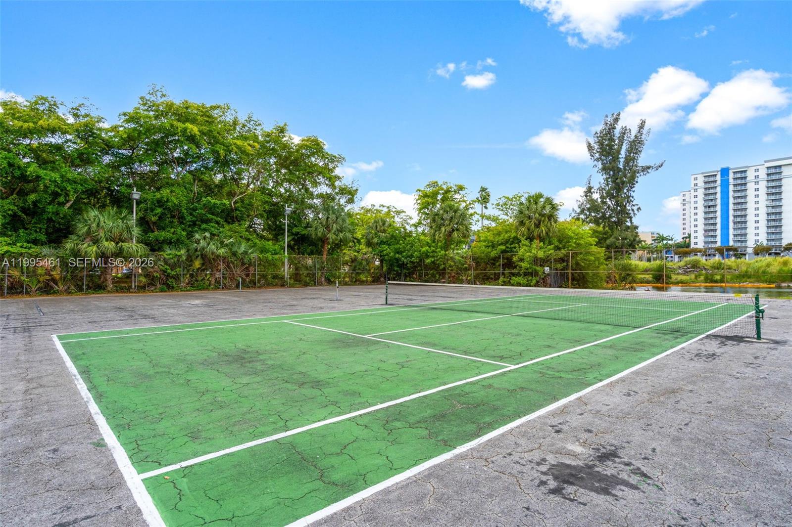 4801 Northwest 7th Street, Unit 40716 Miami, FL 33126 - Photo 24 of 26 a view of a tennis court