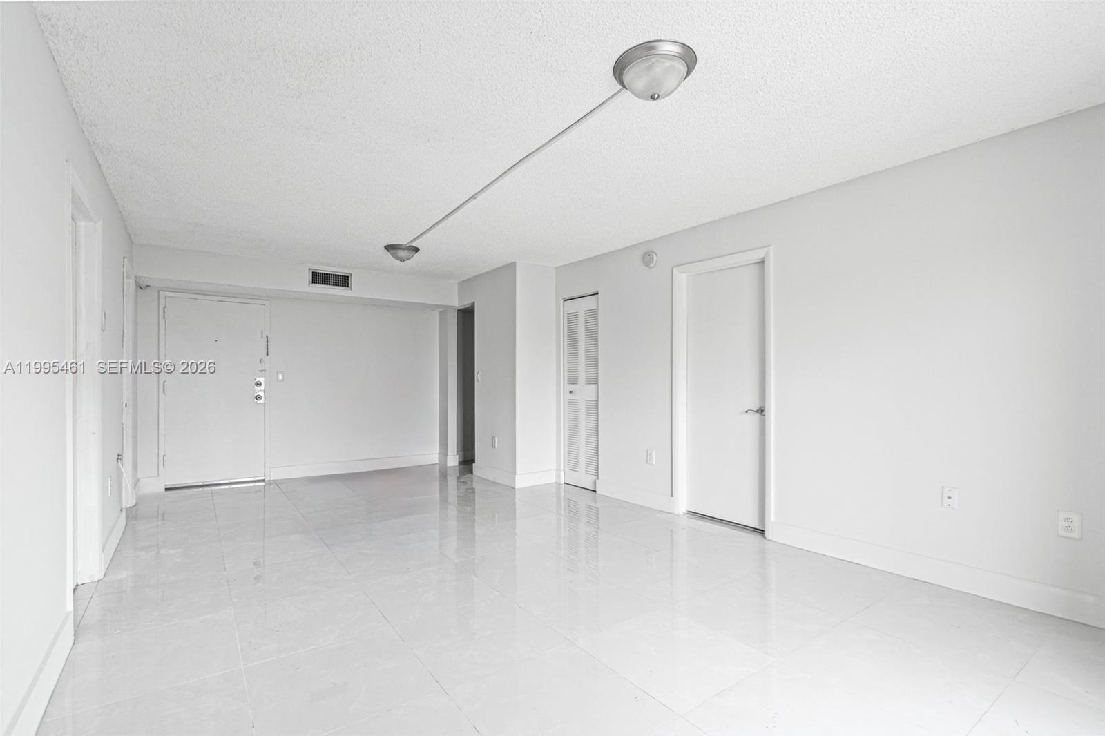 4801 Northwest 7th Street, Unit 40716 Miami, FL 33126 - Photo 4 of 26 a view of an empty room