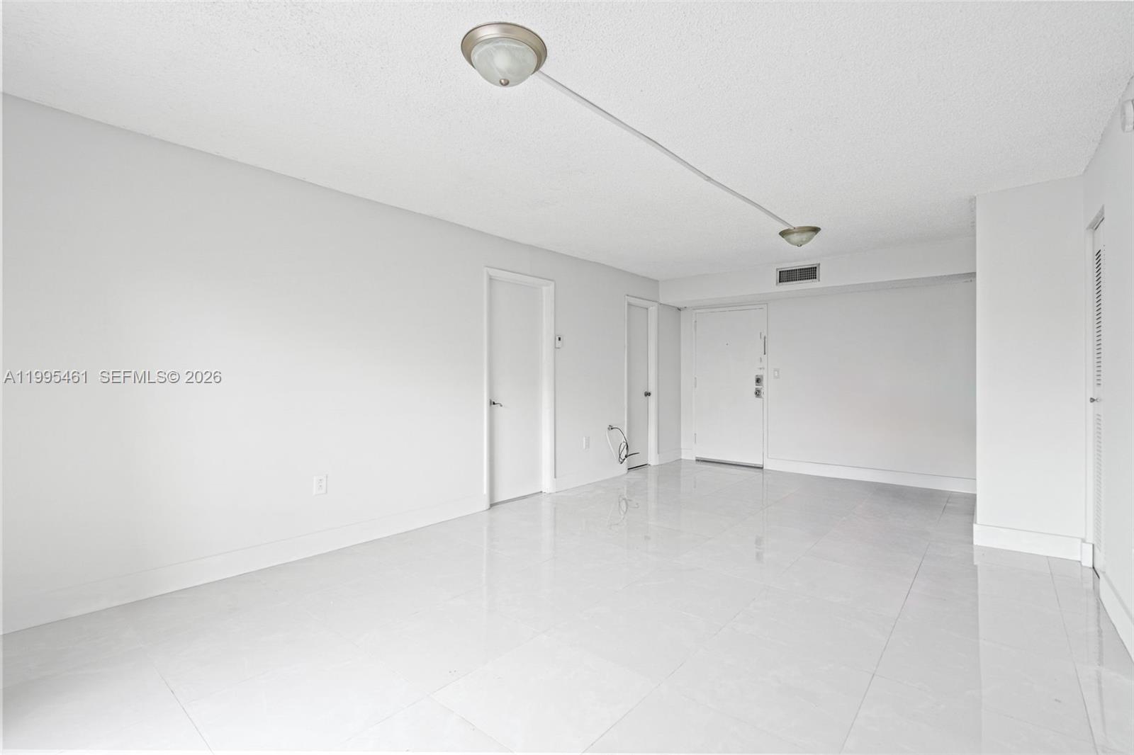 4801 Northwest 7th Street, Unit 40716 Miami, FL 33126 - Photo 5 of 26 a view of an empty room