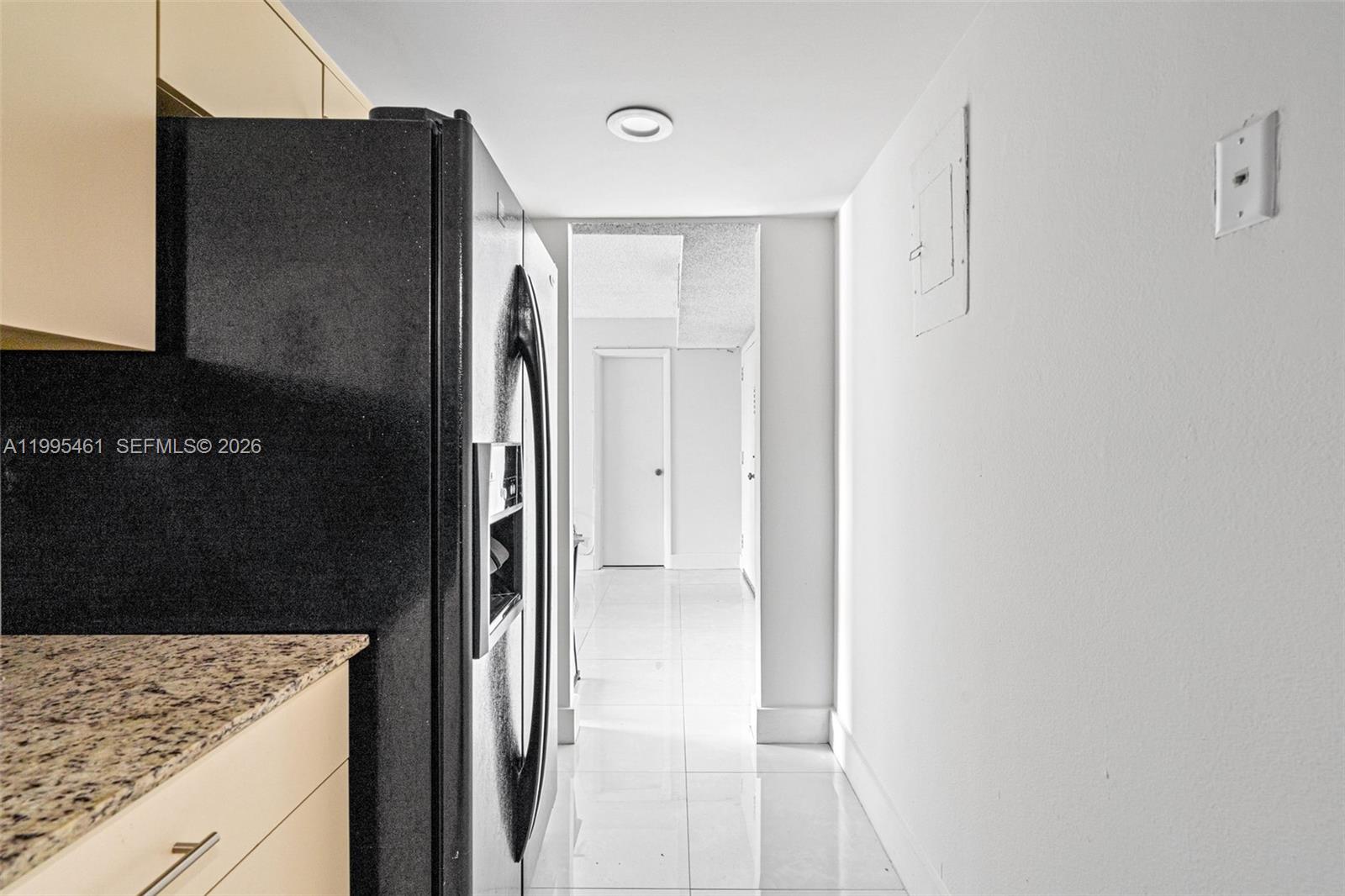 4801 Northwest 7th Street, Unit 40716 Miami, FL 33126 - Photo 9 of 26 a view of kitchen with a refrigerator and sink