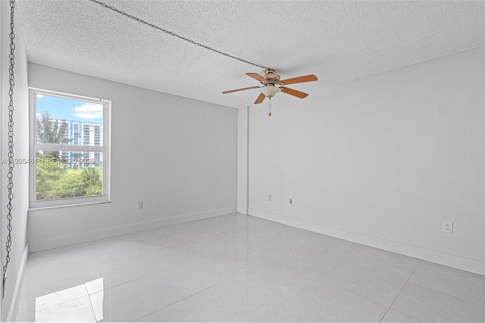 4801 Northwest 7th Street, Unit 40716 Miami, FL 33126 - Photo 10 of 26 an empty room with a window