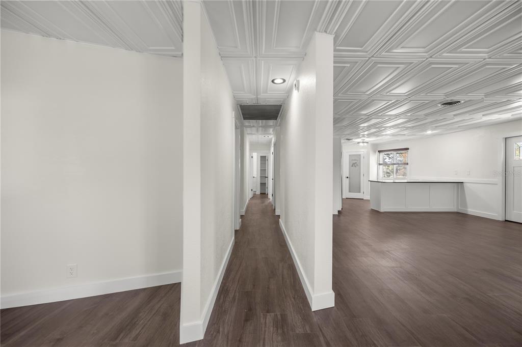 6391 Southeast 186 Terrace Morriston, FL 32668 - Photo 12 of 53 a view of a hallway with wooden floor