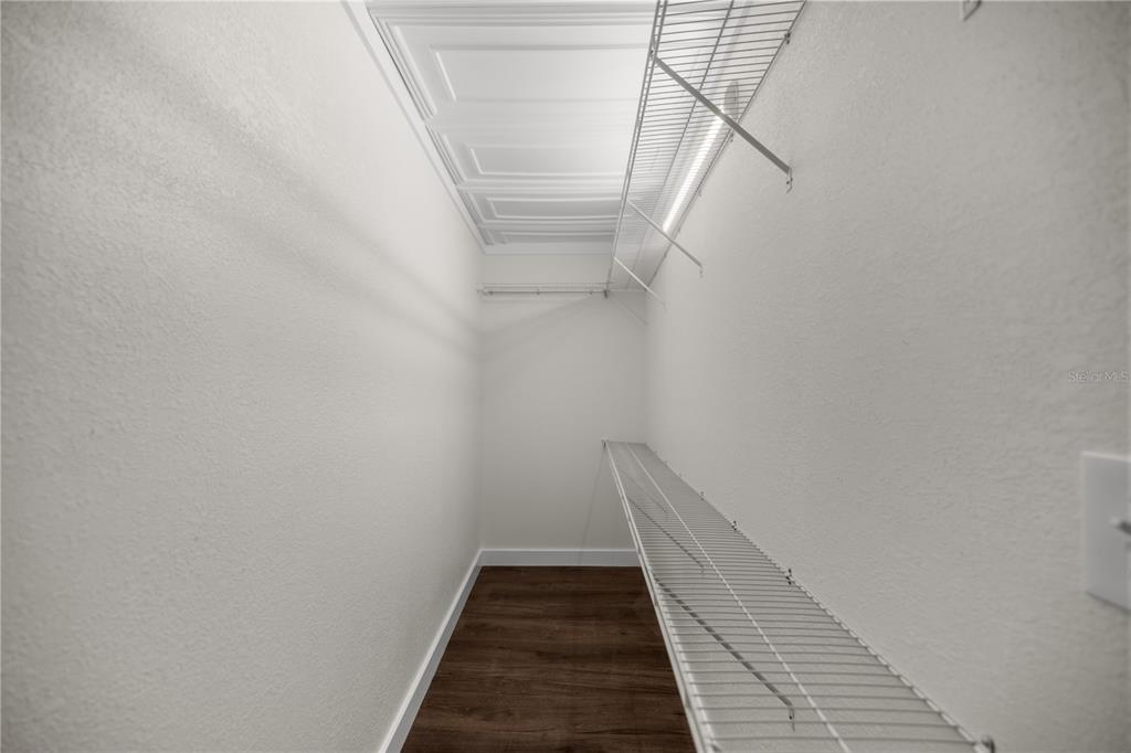 6391 Southeast 186 Terrace Morriston, FL 32668 - Photo 18 of 53 a view of a hallway with wooden floor