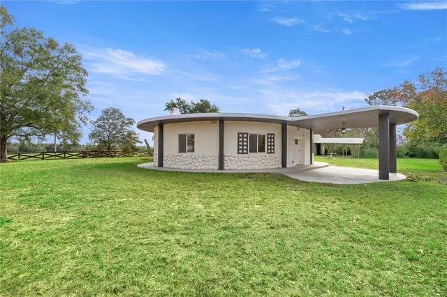 a view of a house with a garden