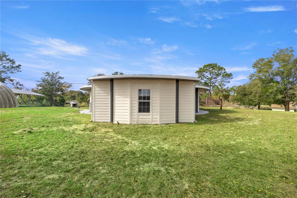 6391 Southeast 186 Terrace Morriston, FL 32668 - Photo 33 of 53 a view of a house with a yard