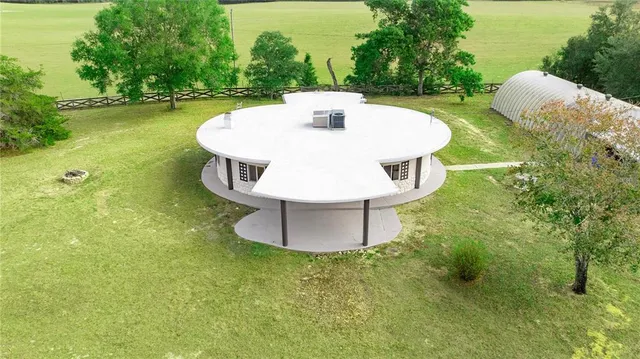 a view of a yard with an outdoor space and seating area