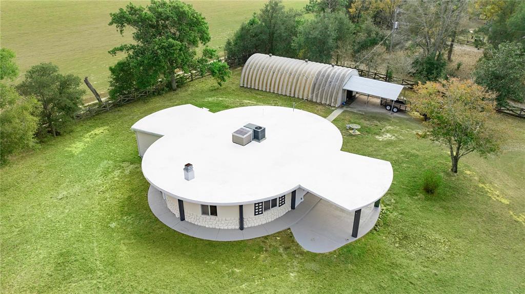 6391 Southeast 186 Terrace Morriston, FL 32668 - Photo 45 of 53 a view of a swimming pool with a yard and plants