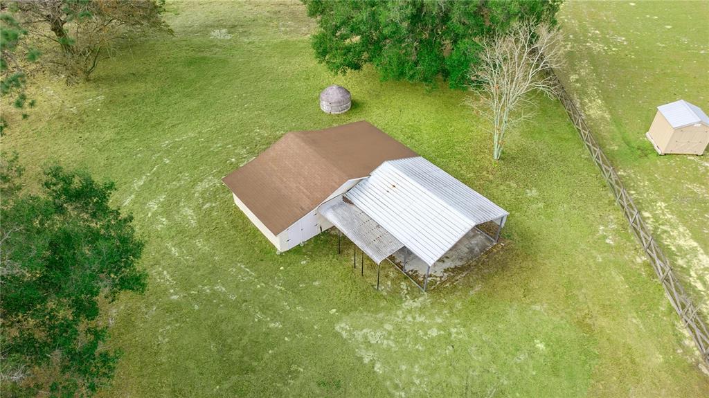 6391 Southeast 186 Terrace Morriston, FL 32668 - Photo 47 of 53 a view of a yard with an outdoor space and seating area