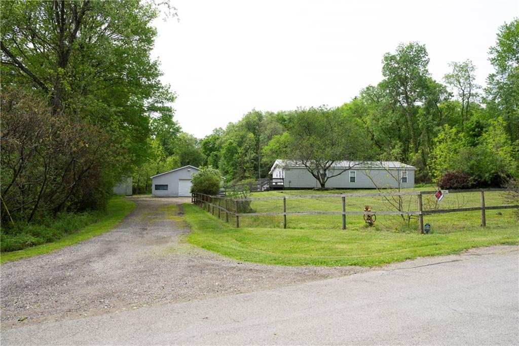 9133 South Watson Run Road Meadville, PA 16335 - Photo 36 of 45 a front view of a house with a yard and trees