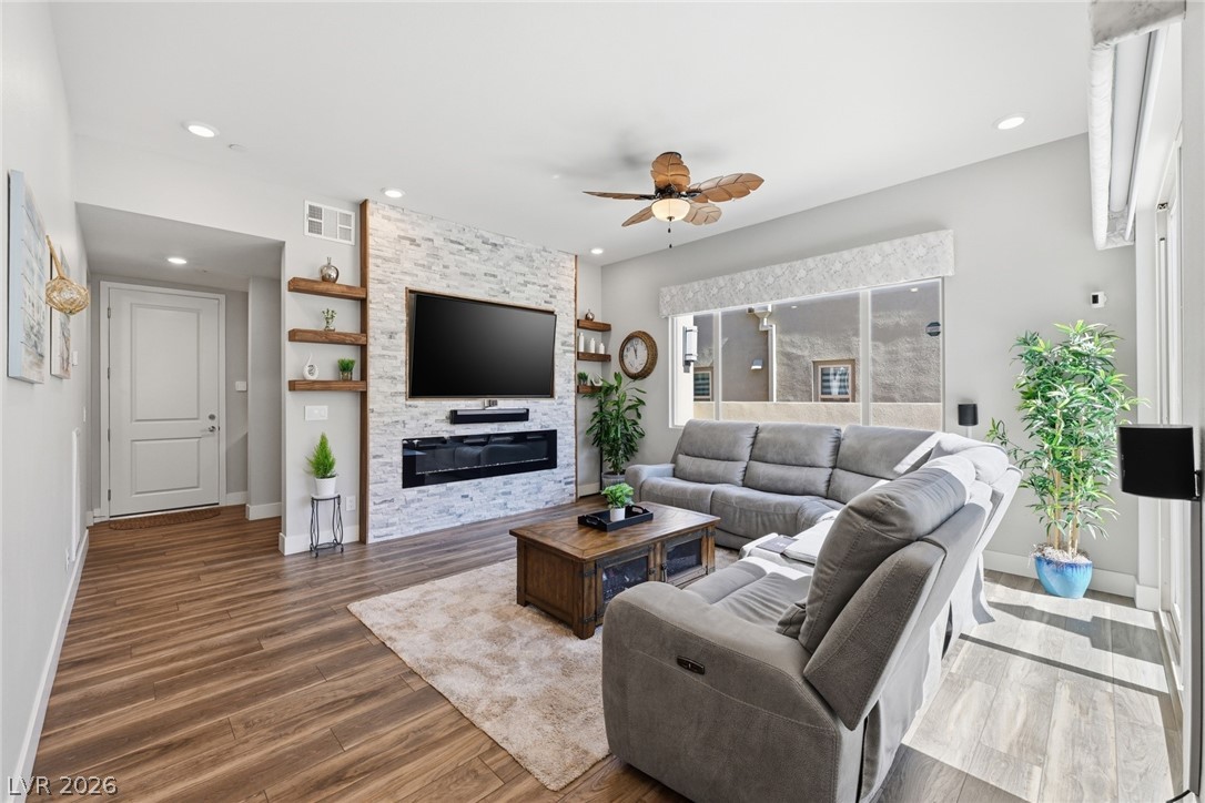 4246 Swift Street Las Vegas, NV 89135 - Photo 8 of 71 Living area featuring a ceiling fan, wood finished floors, and recessed lighting