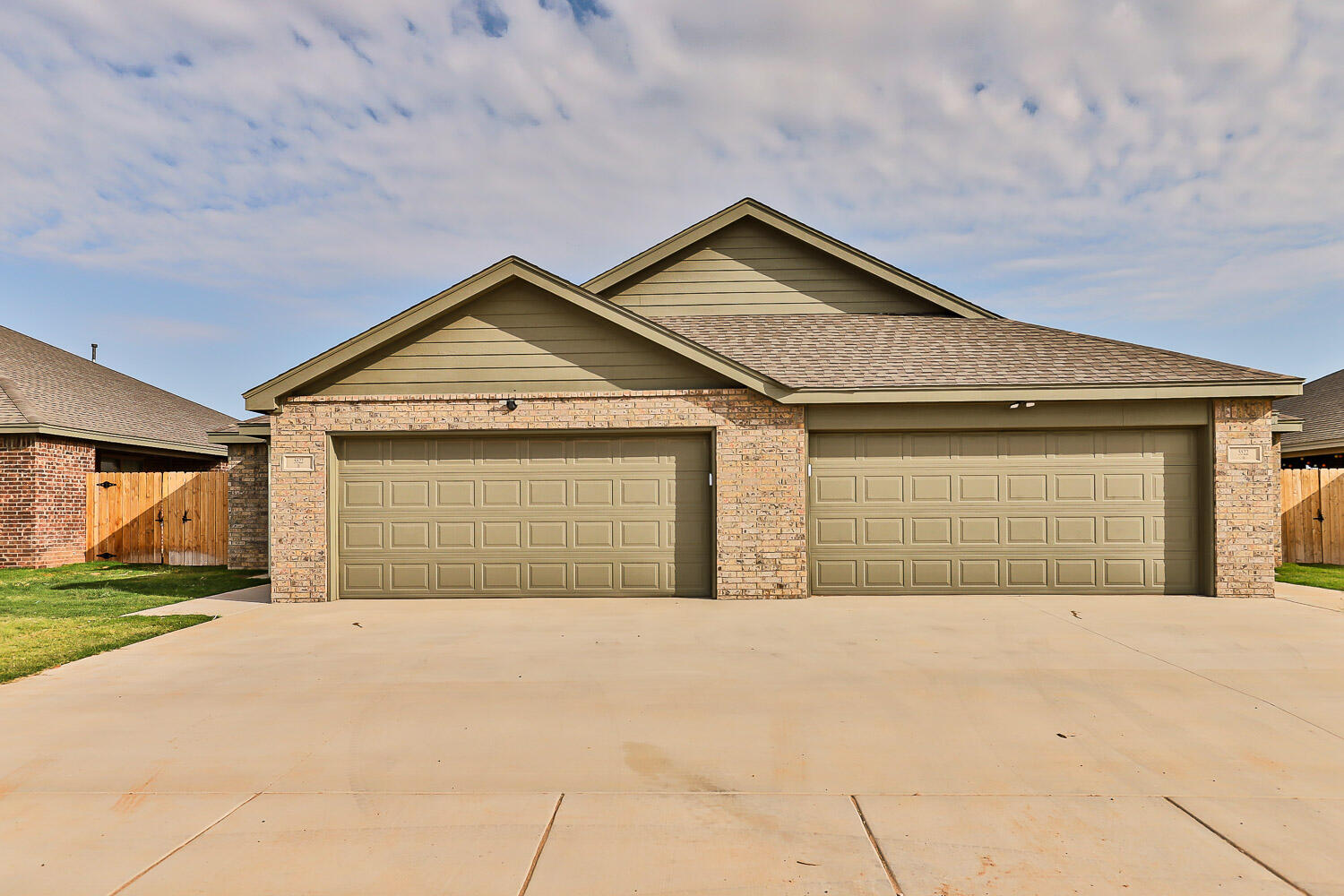 5508 122nd Street Lubbock, TX 79424 - Photo 2 of 20 a front view of a house with a yard and garage
