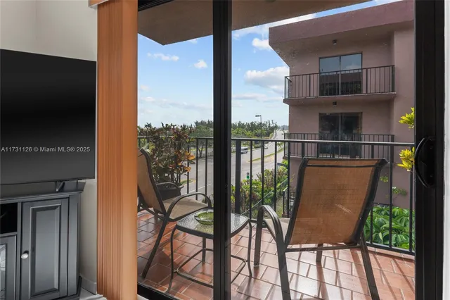 a view of balcony with furniture