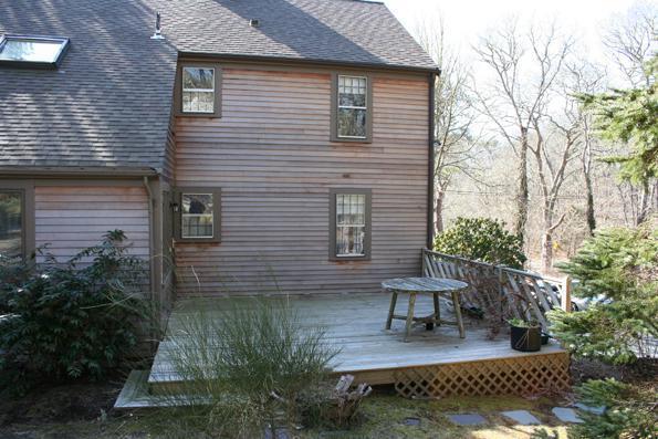 100 Namequoit Road Orleans, MA 02653 - Photo 3 of 13 a view of house with backyard and sitting area