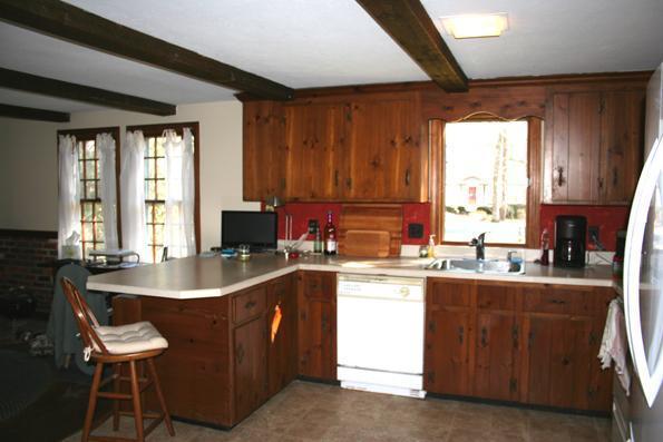 100 Namequoit Road Orleans, MA 02653 - Photo 7 of 13 a kitchen with a sink stove and cabinets