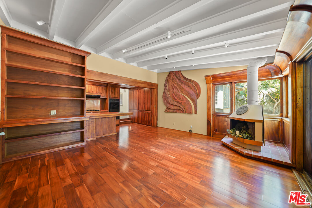455 El Bosque Laguna Beach, CA 92651 - Photo 15 of 57 a view of a room with wooden floor and furniture