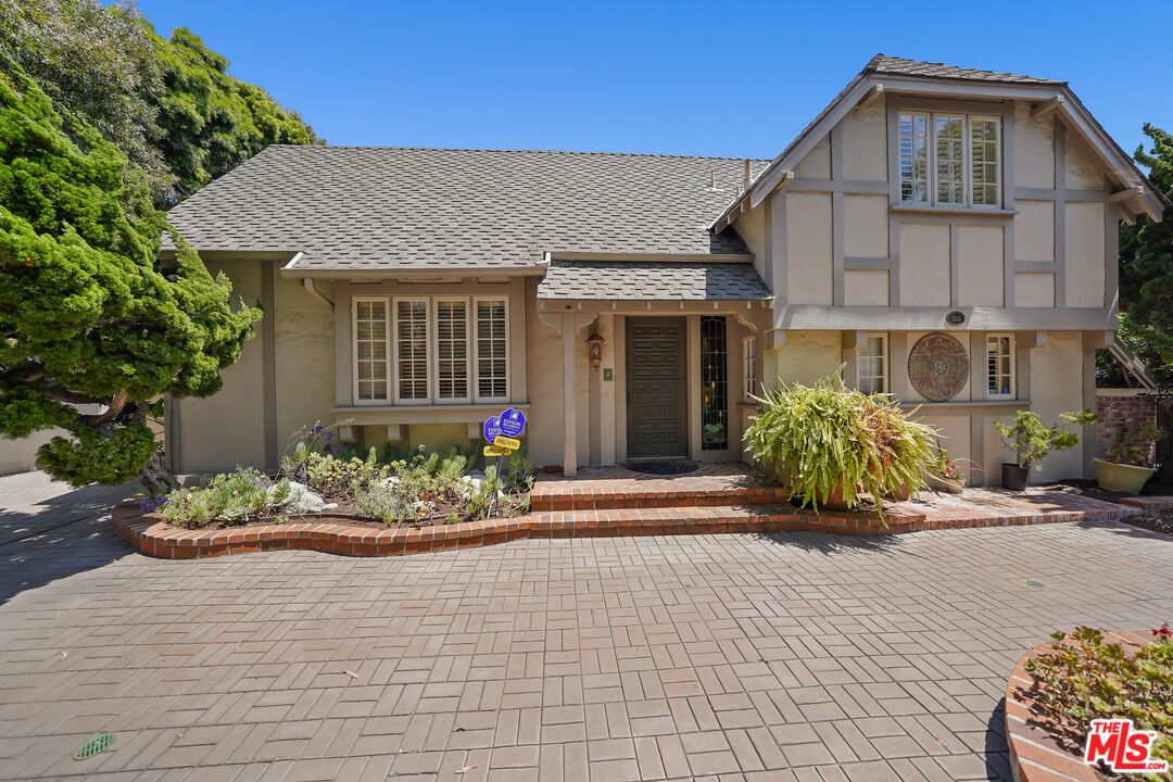 455 El Bosque Laguna Beach, CA 92651 - Photo 2 of 57 a front view of a house with a yard and seating space