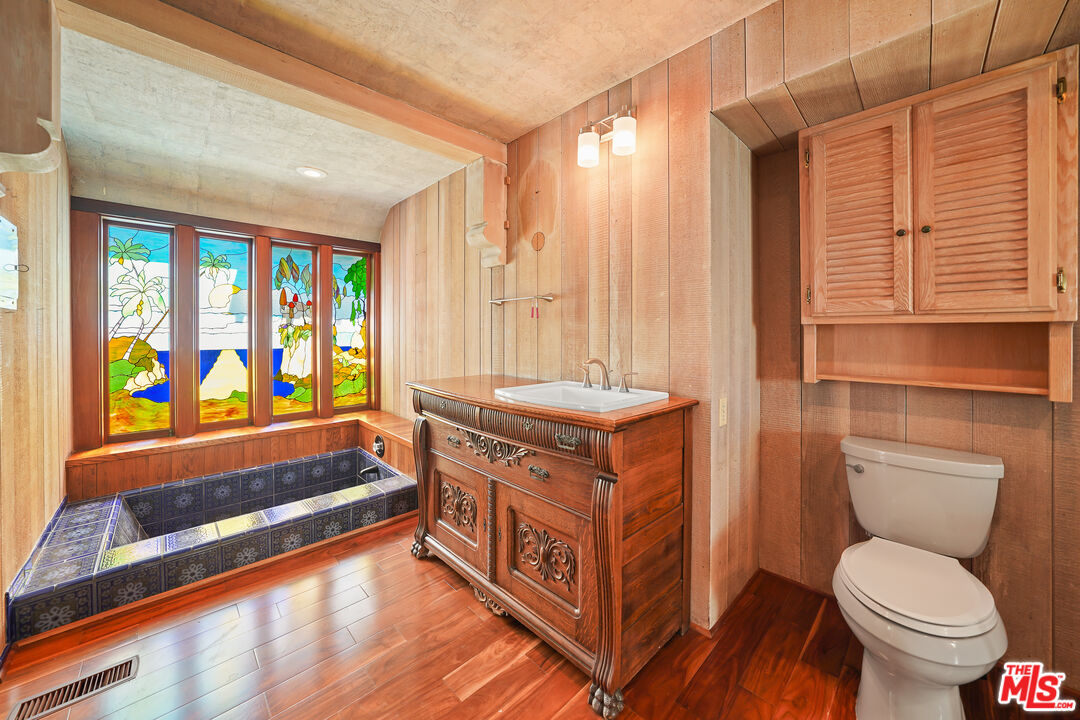 455 El Bosque Laguna Beach, CA 92651 - Photo 21 of 57 a bathroom with a sink a toilet and a bathtub