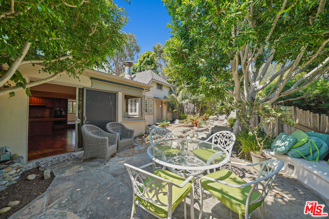 455 El Bosque Laguna Beach, CA 92651 - Photo 36 of 57 a view of a patio with table and chairs and potted plants